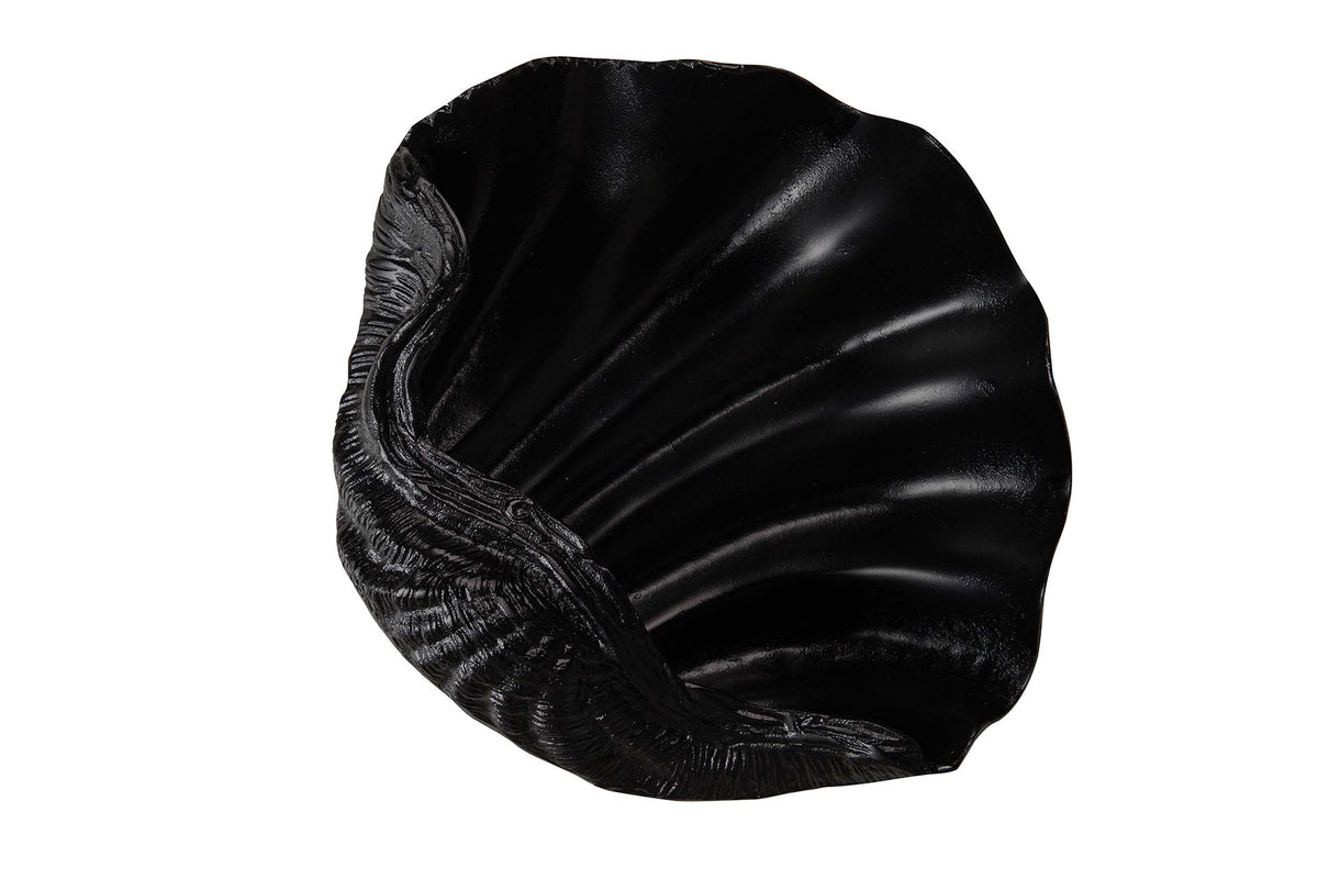 A black shell-shaped decorative bowl or dish with a textured, ribbed exterior and smooth, glossy interior.